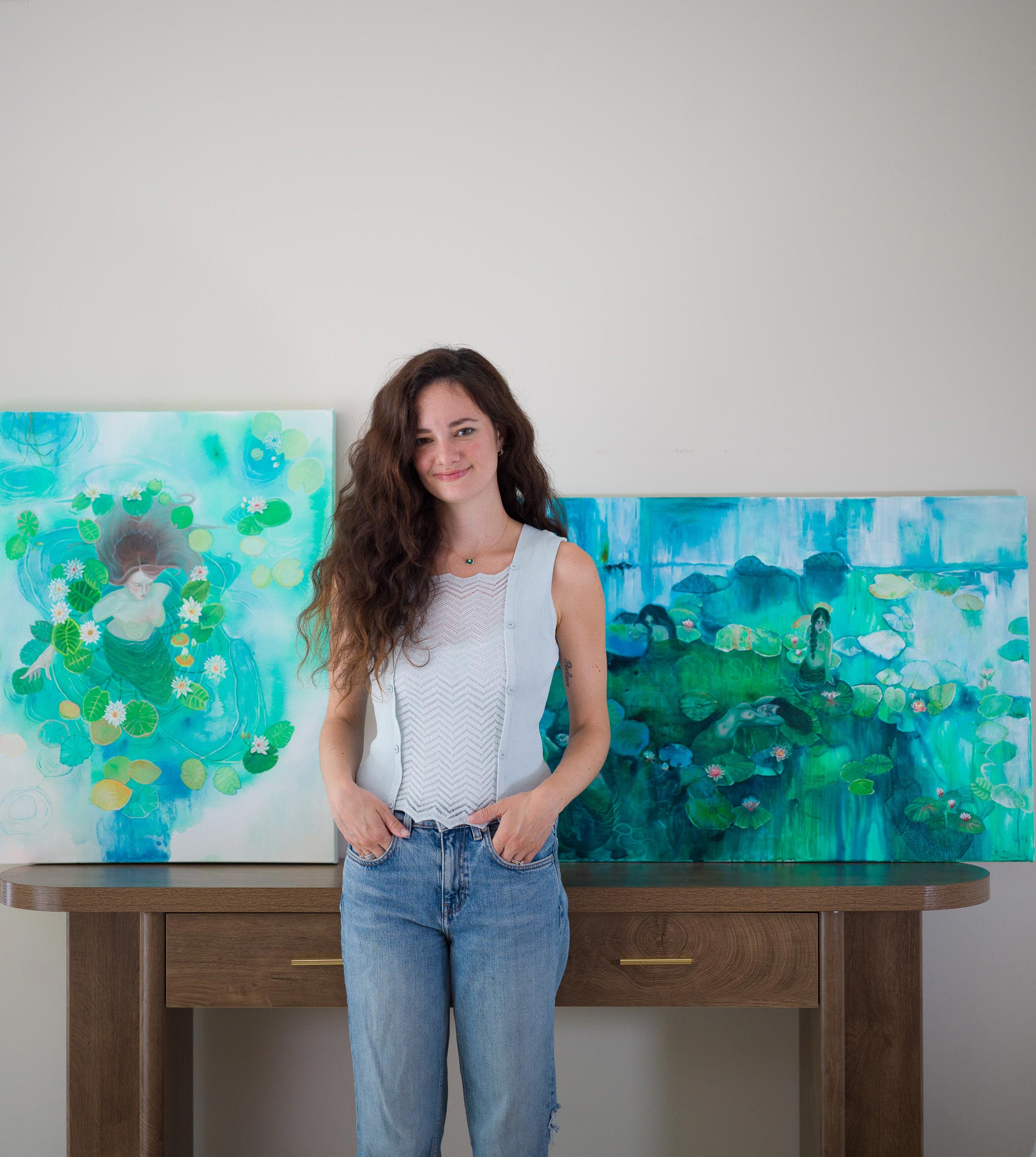 Two large contemporary mermaid paintings in shades of blue, green, and white